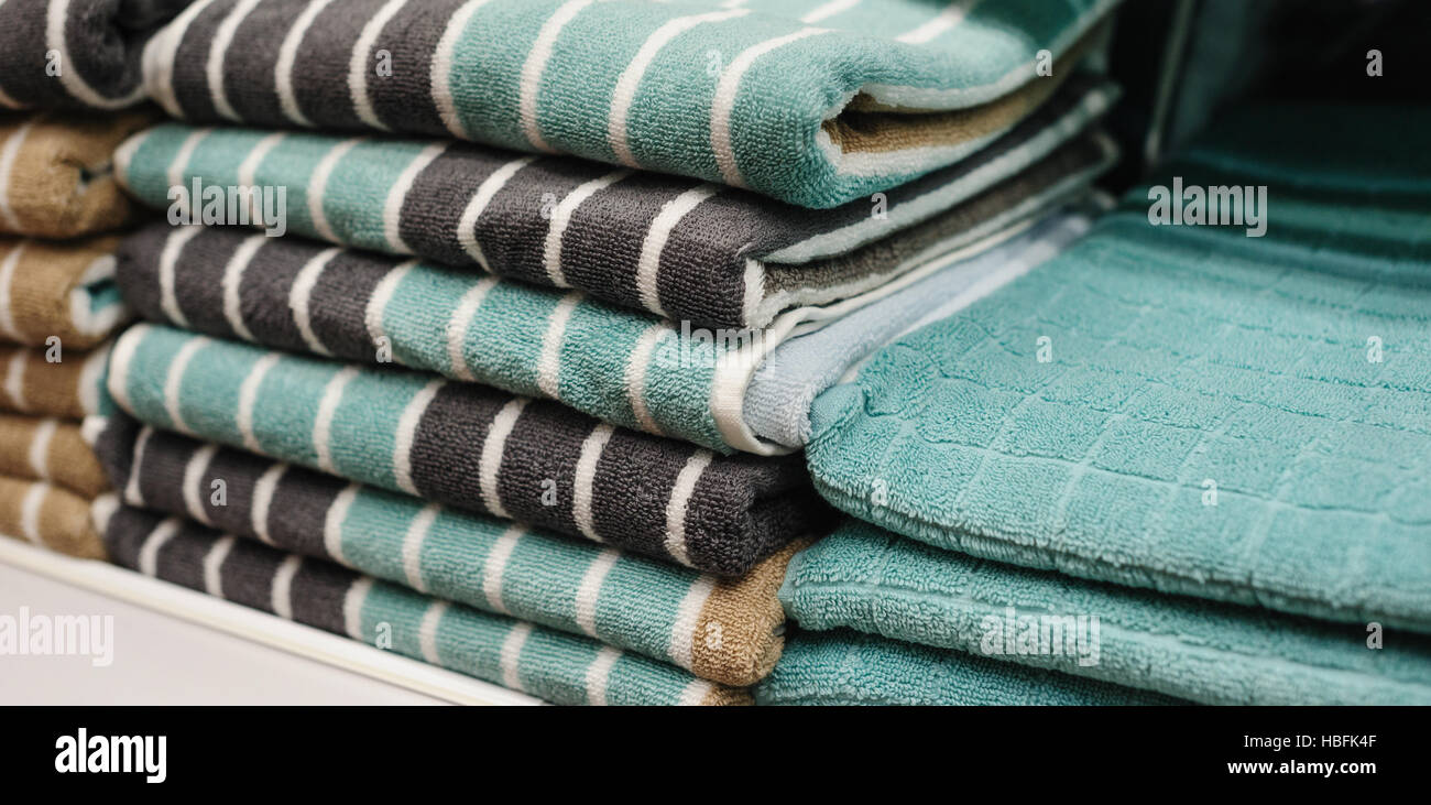 towels on the shelves in store Stock Photo Alamy
