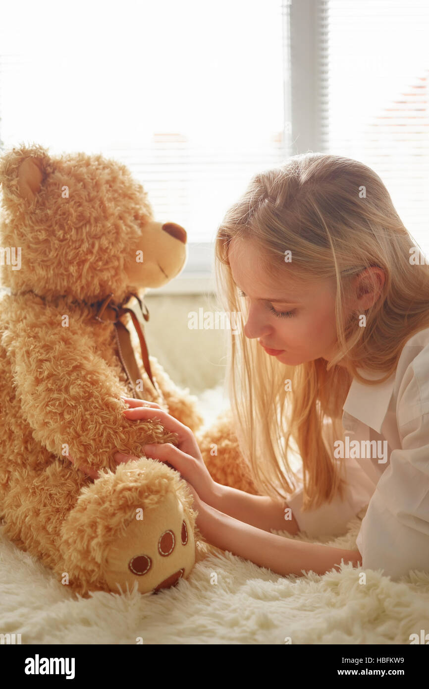 sad teddy bear with girl