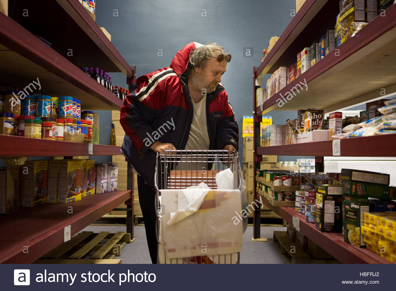 A Man Gets Donated Food At The Jordan River Food Pantry Stock