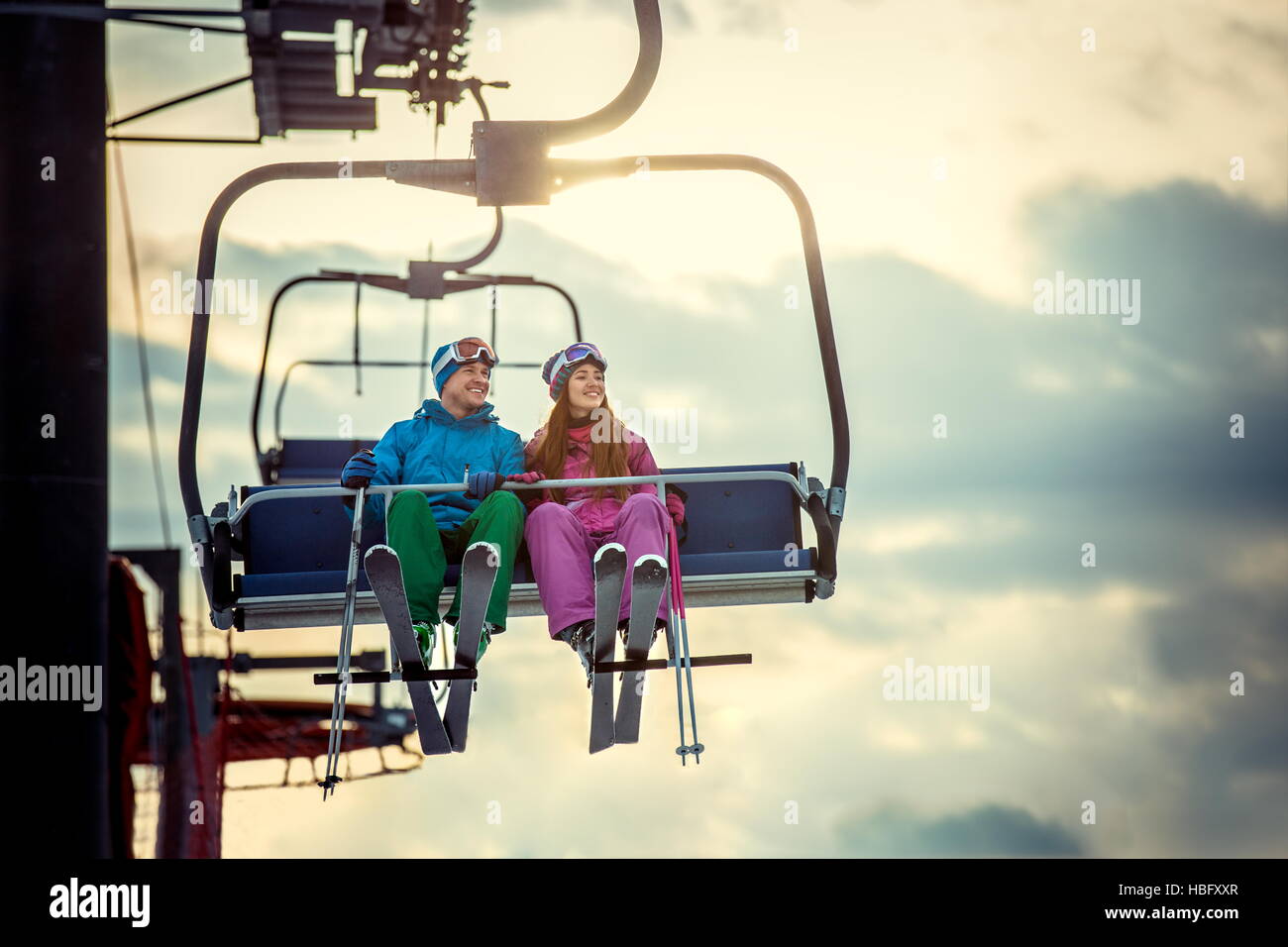 Skiers on a lift Stock Photo - Alamy