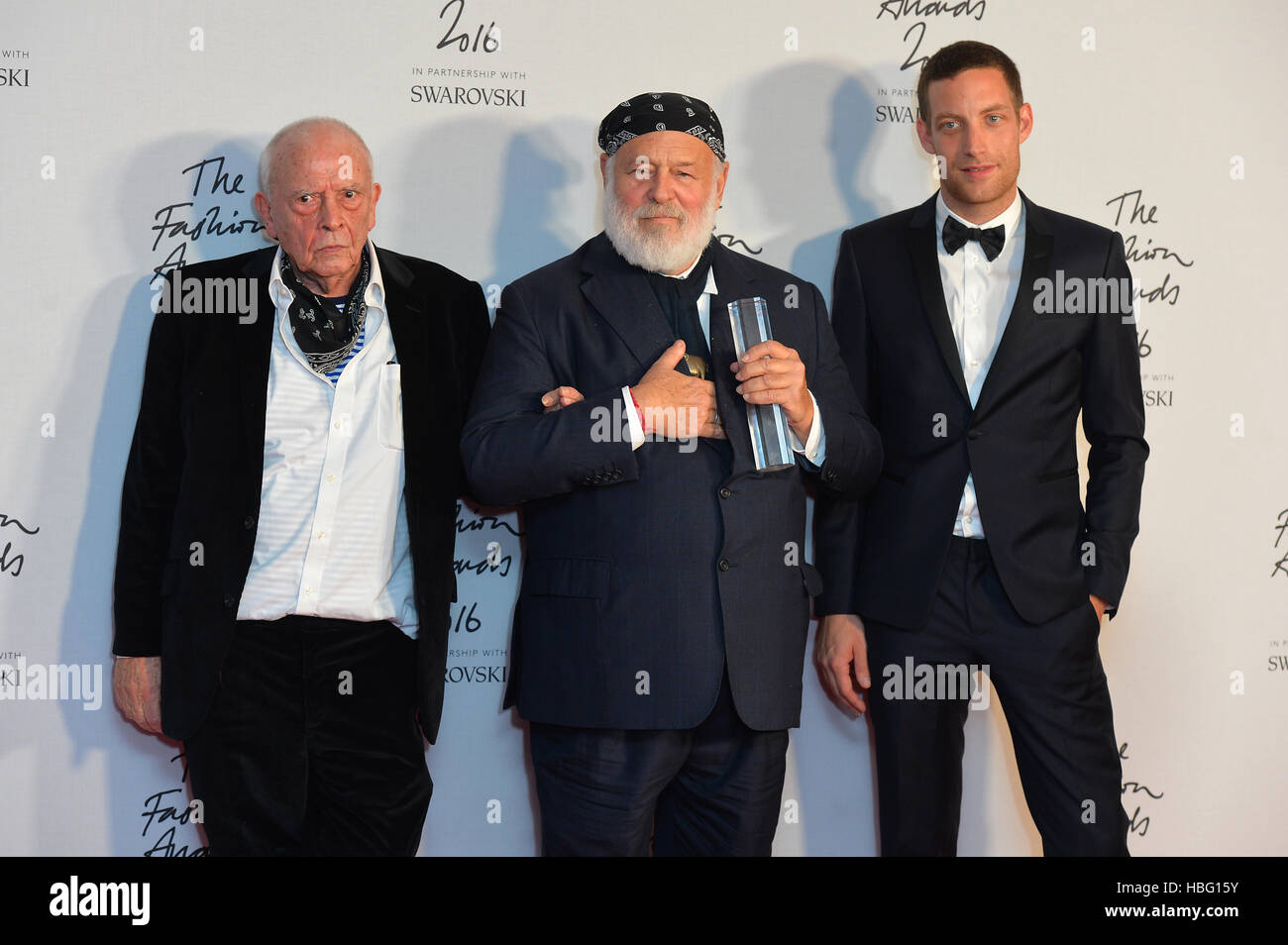 Bruce Weber with his Isabela Blow Award for Fashion Creator, alongside David Bailey and James Jagger in the press room during The Fashion Awards 2016 at the Royal Albert Hall, London. Stock Photo