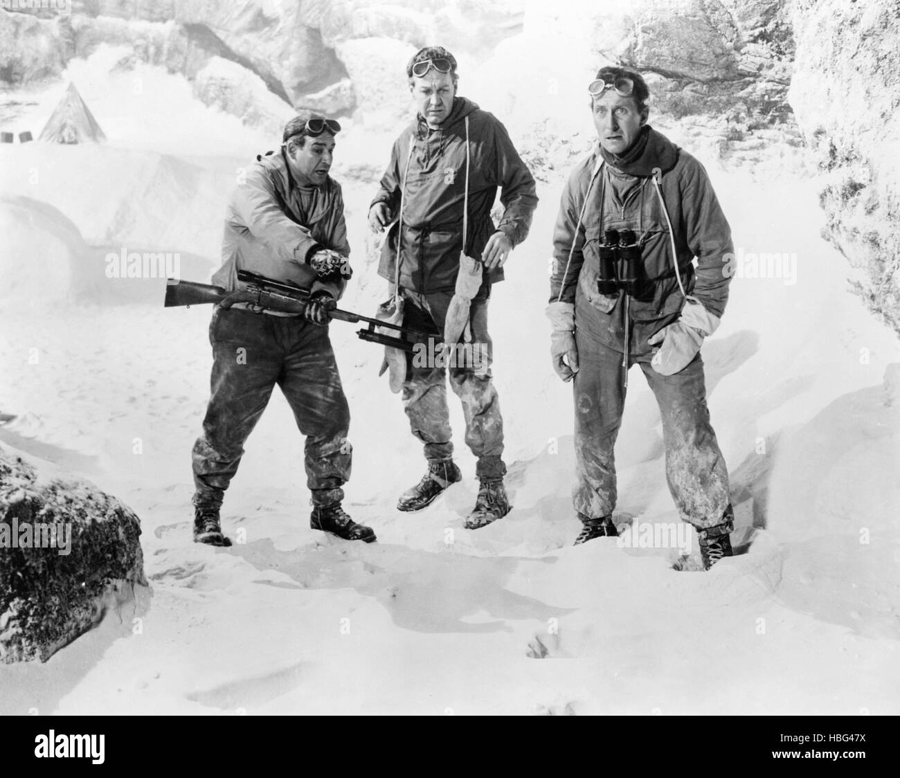 THE ABOMINABLE SNOWMAN, (aka THE ABOMINABLE SNOWMAN OF THE HIMALAYAS), from left: Robert Brown, Forrest Tucker, Peter Cushing, Stock Photo