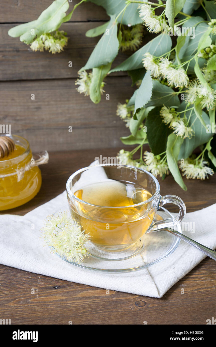 Linden tea in glass cup and jar with honey Stock Photo Alamy