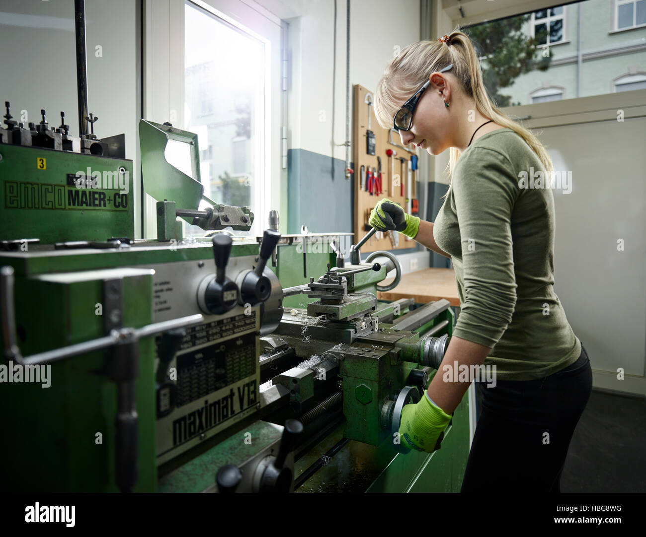 Young woman working on lathe, Metalwork, training Stock Photo Alamy