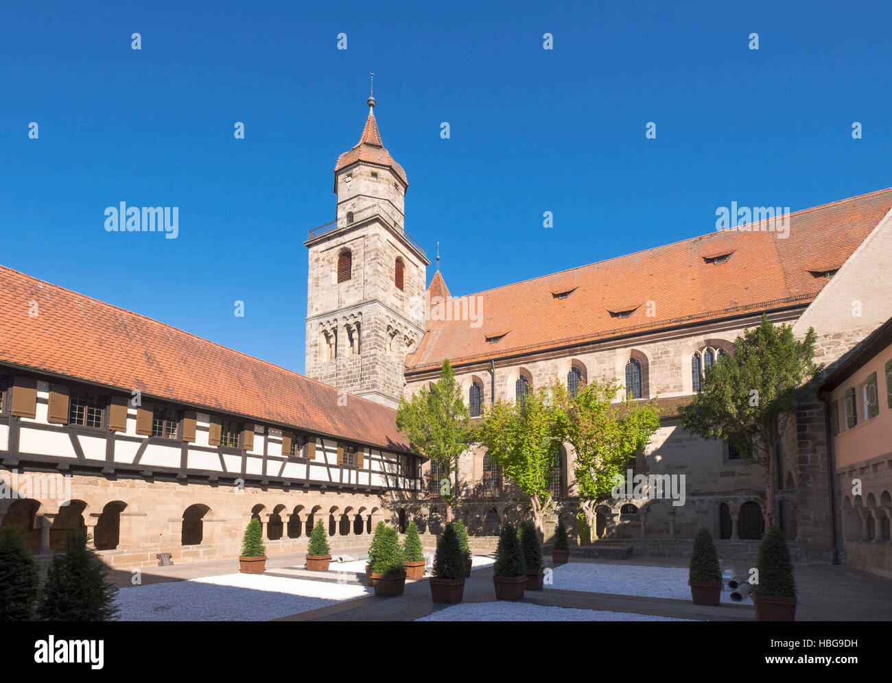 Romanesque cloister and Evangelical Church, Feuchtwangen, Middle Franconia, Franconia, Bavaria, Germany Stock Photo