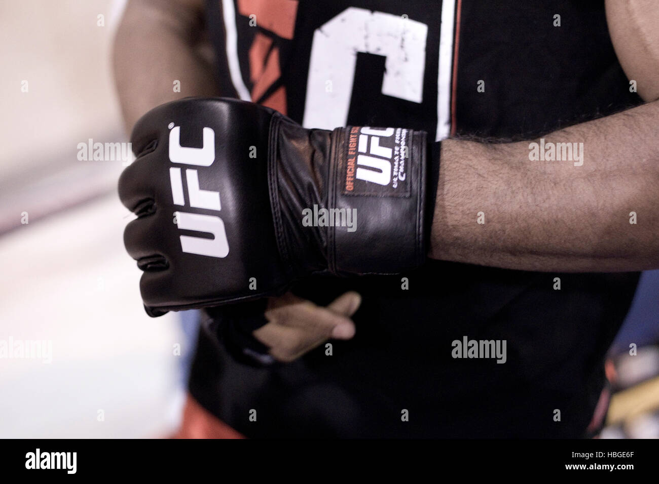UFC fighter Alistair Overeem wraps his hands and puts on gloves during