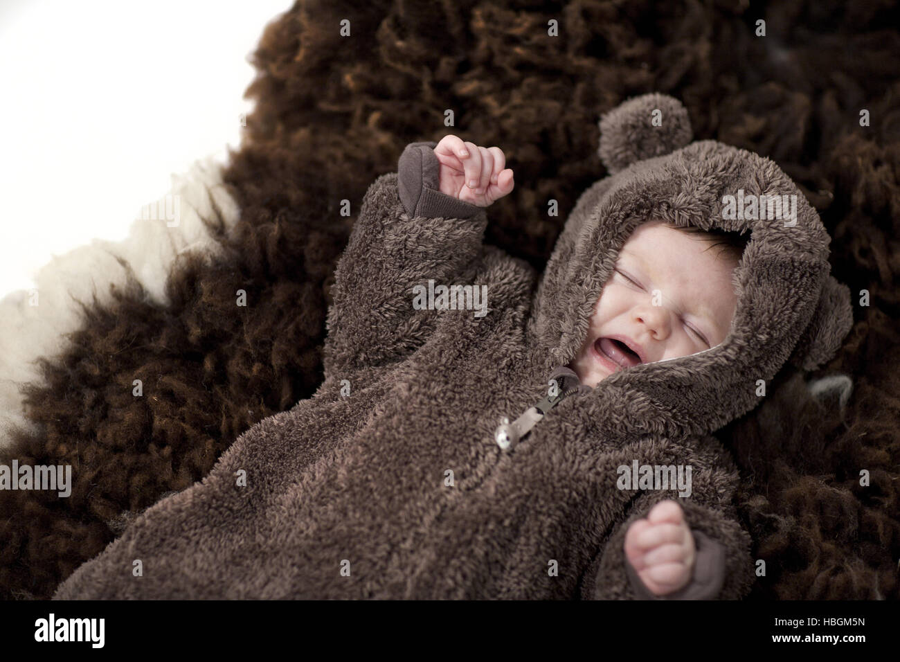 Baby in bear suit Stock Photo Alamy