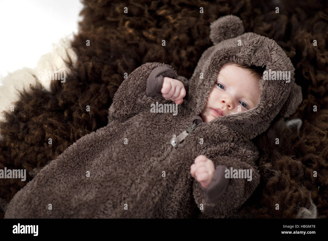 Baby in bear suit Stock Photo