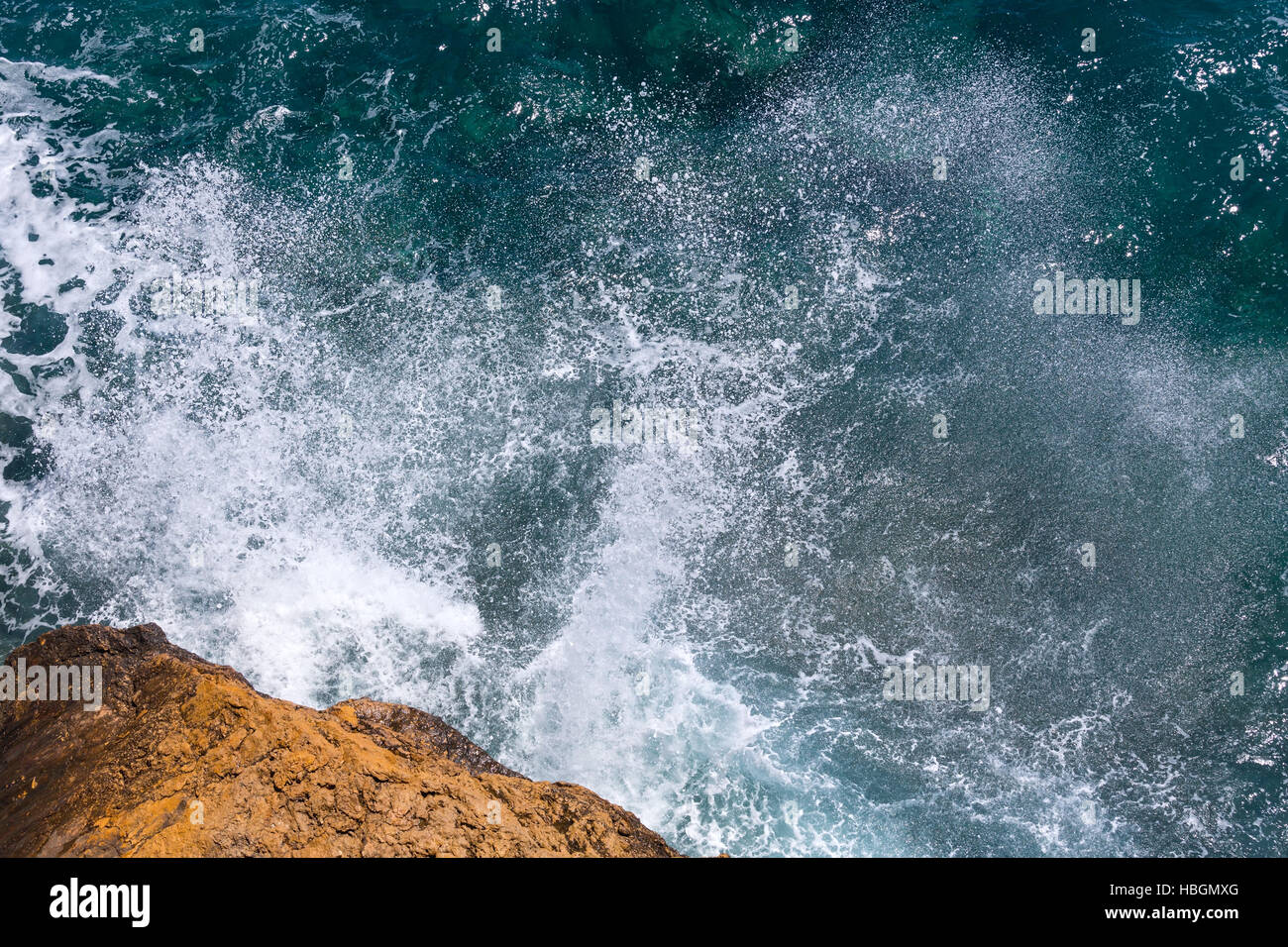 Waves breaking on rocky coast Stock Photo - Alamy