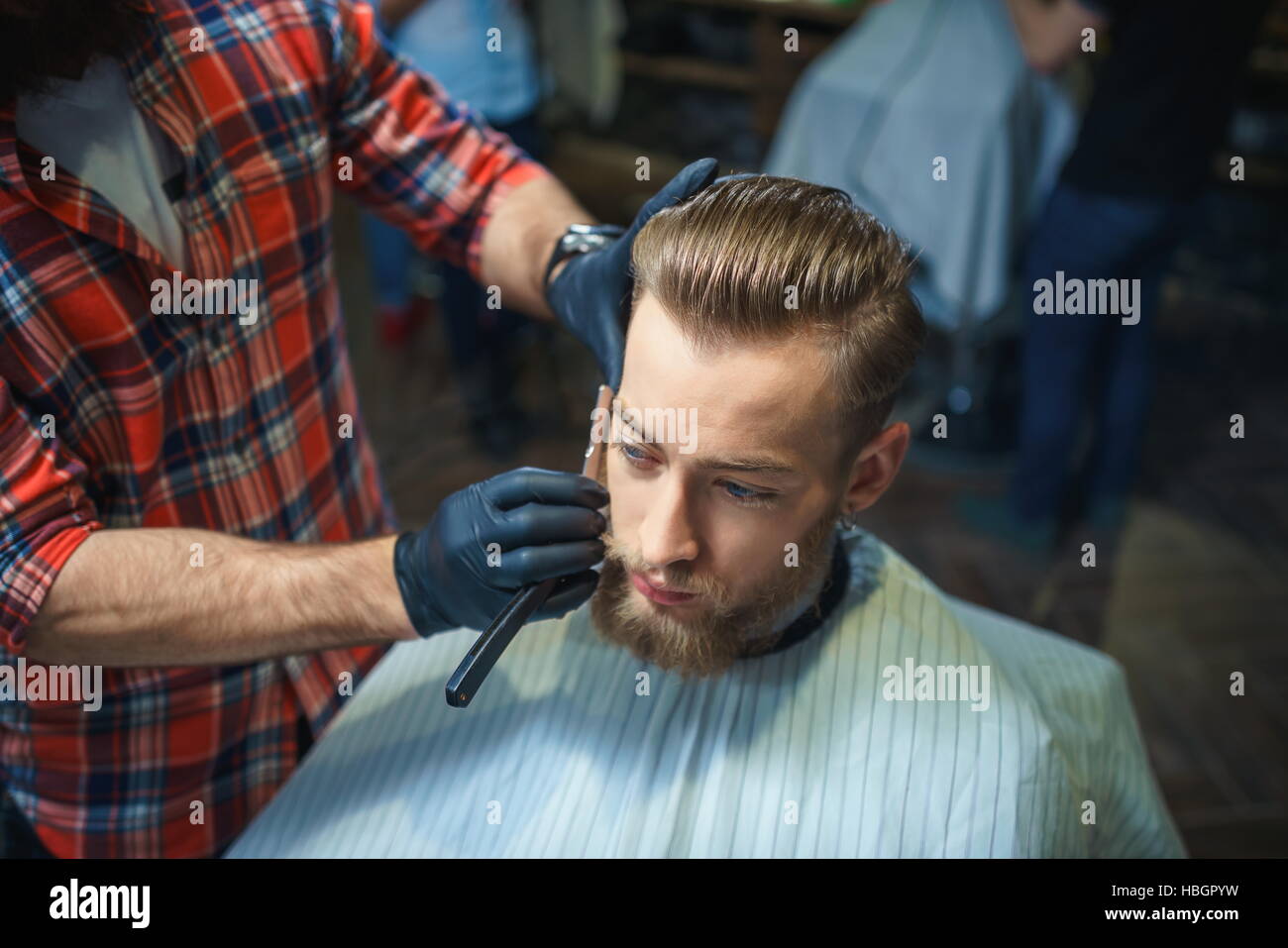 Working at a barber shop hi-res stock photography and images - Alamy