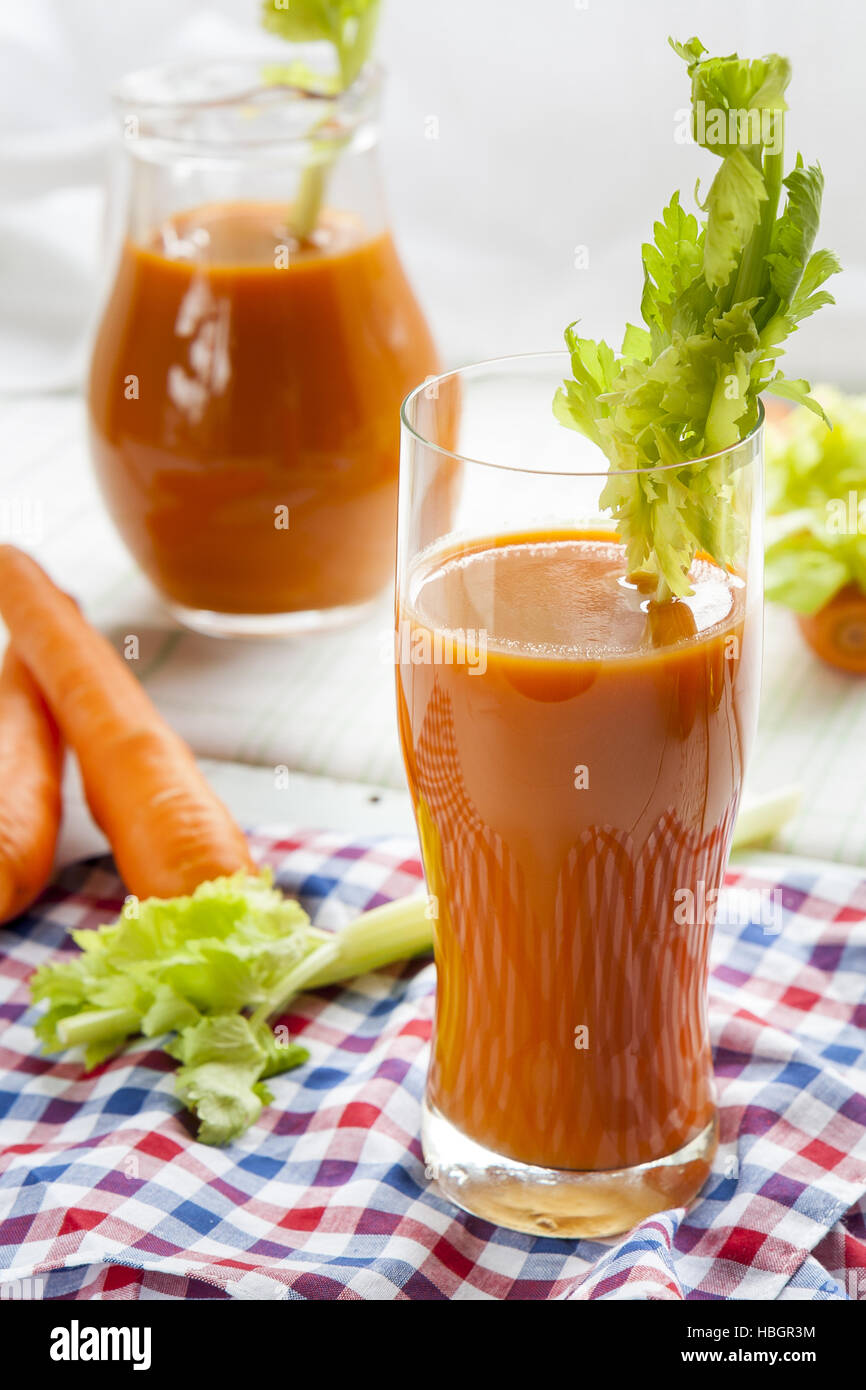 Fresh carrot juice with carrots and celery Stock Photo Alamy