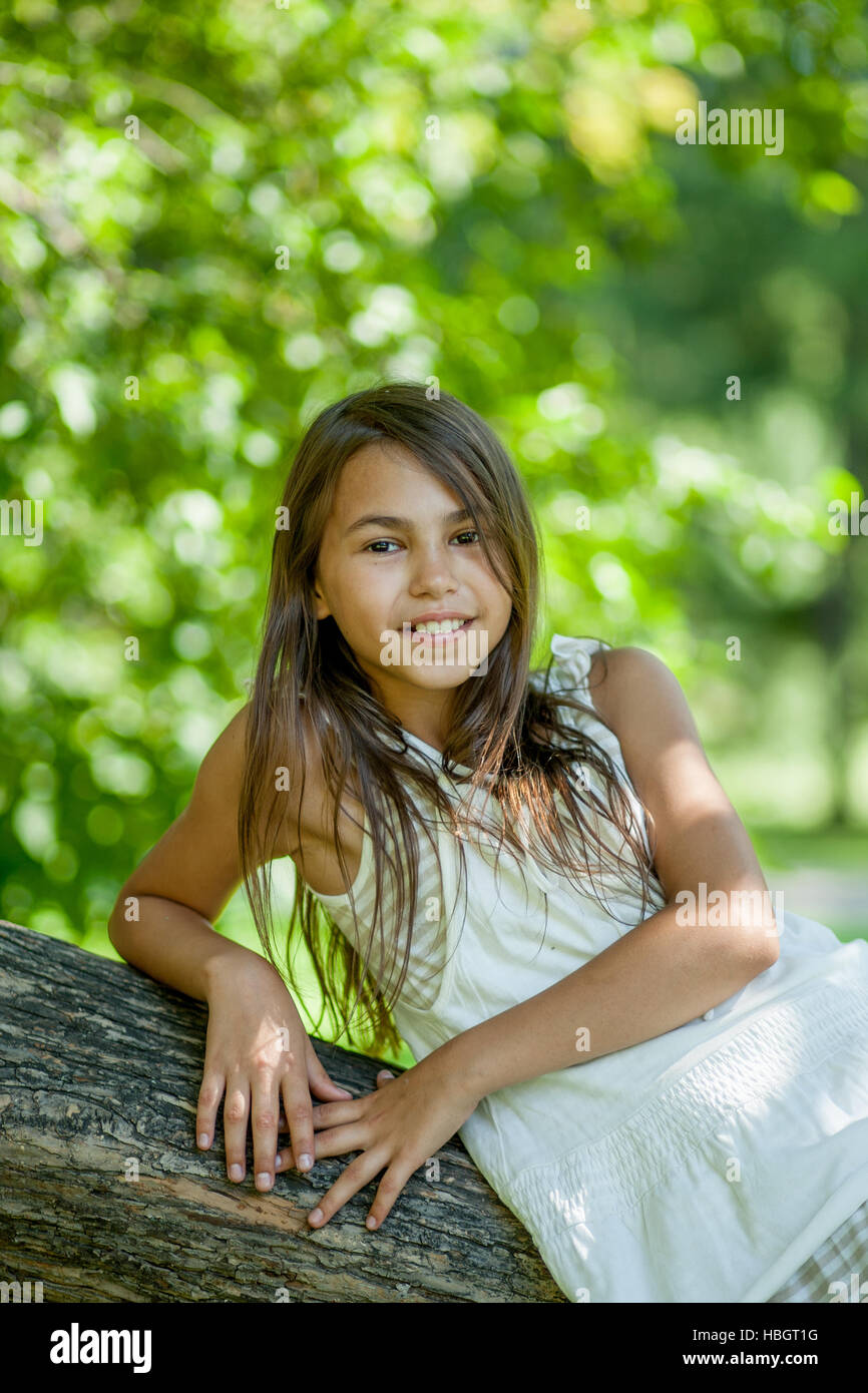 girl lying on a tree Stock Photo - Alamy