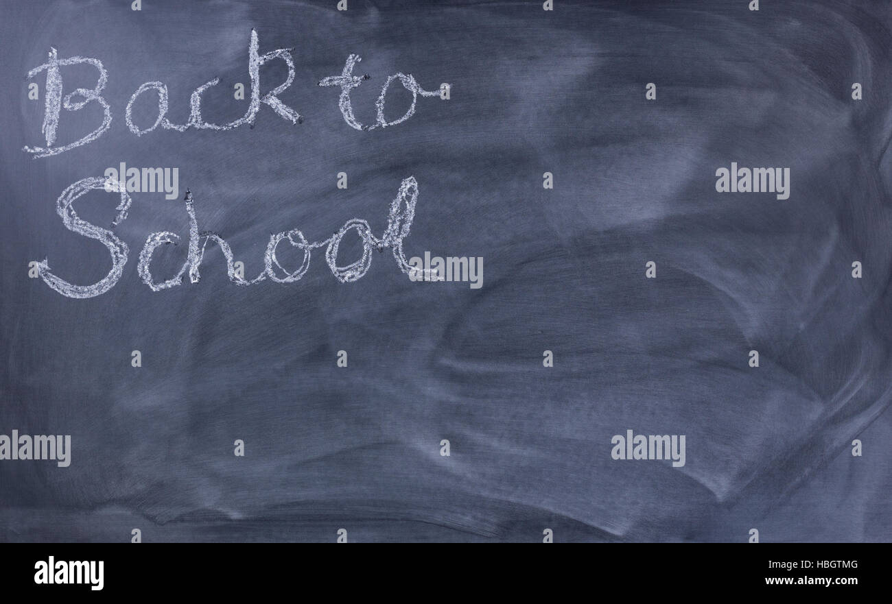 Back to school text on erased chalkboard Stock Photo - Alamy