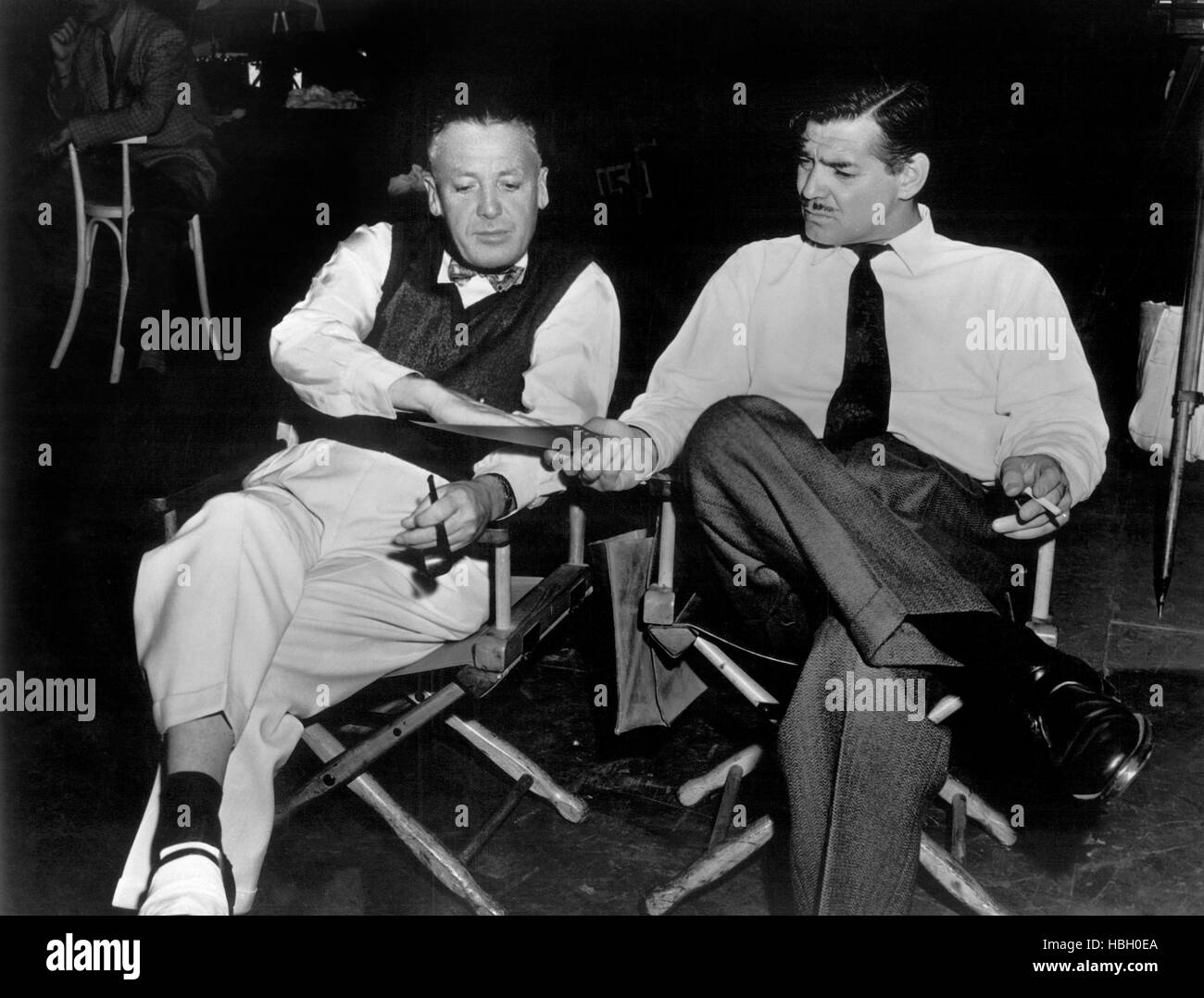 ADVENTURE, MGM talent head Billy Grady and Clark Gable review a ...