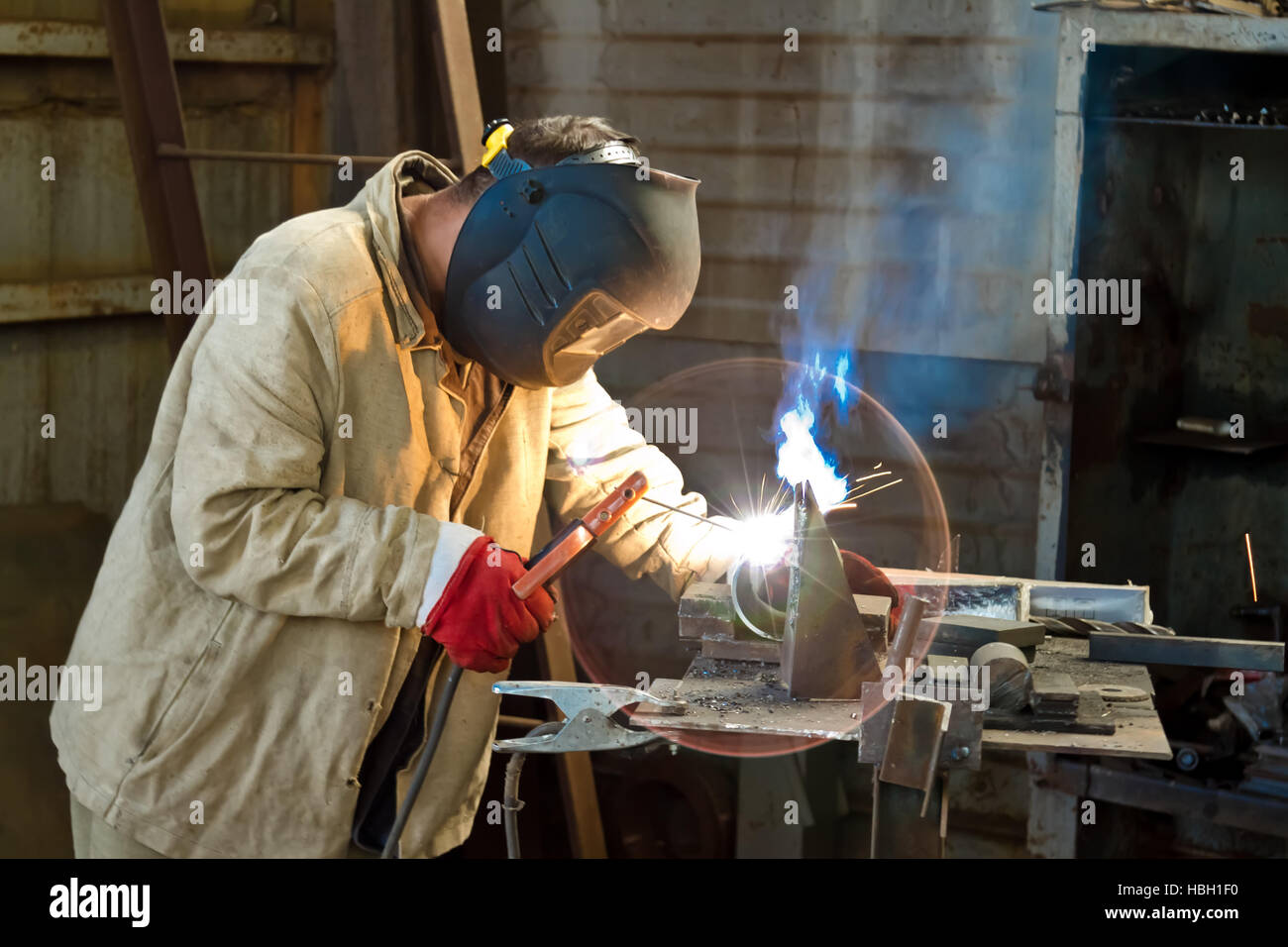 Welder busy parts of the pipeline Stock Photo