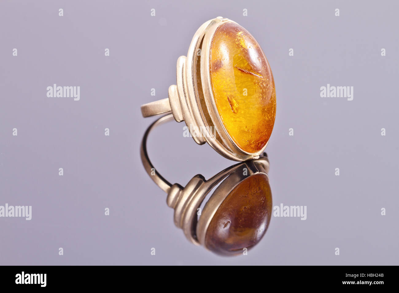 Old gold ring with inset amber Stock Photo