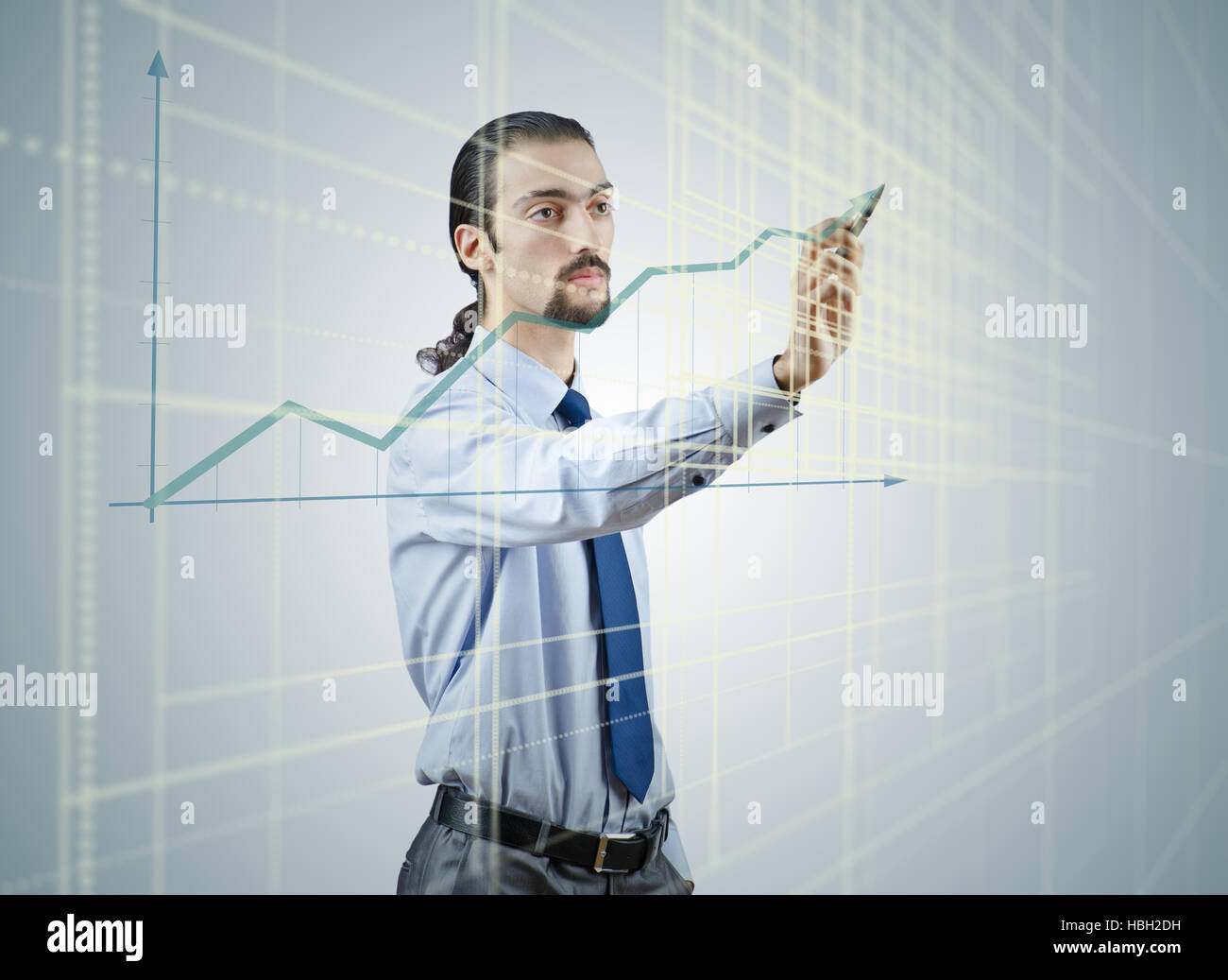 Young businessman with chart diagrams Stock Photo - Alamy