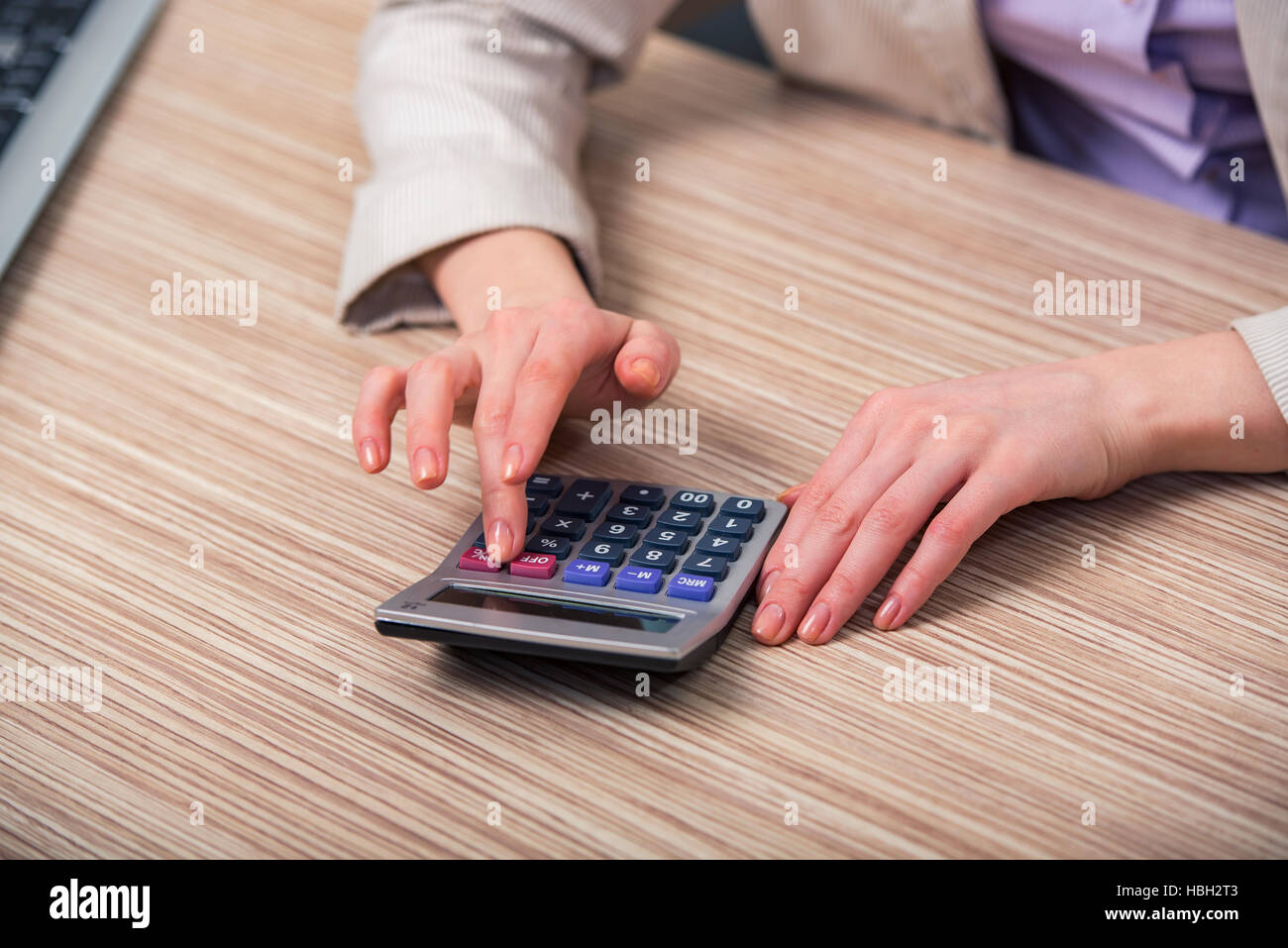 Hands working on the calculator Stock Photo Alamy