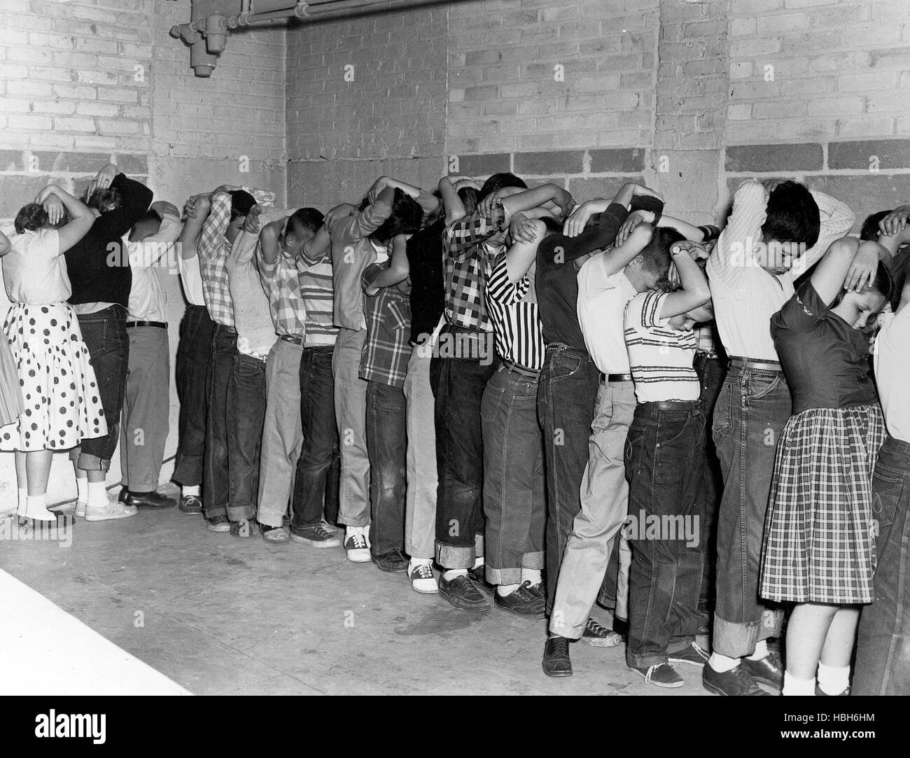 ATOMIC CAFE, official civil defense photograph of school children in