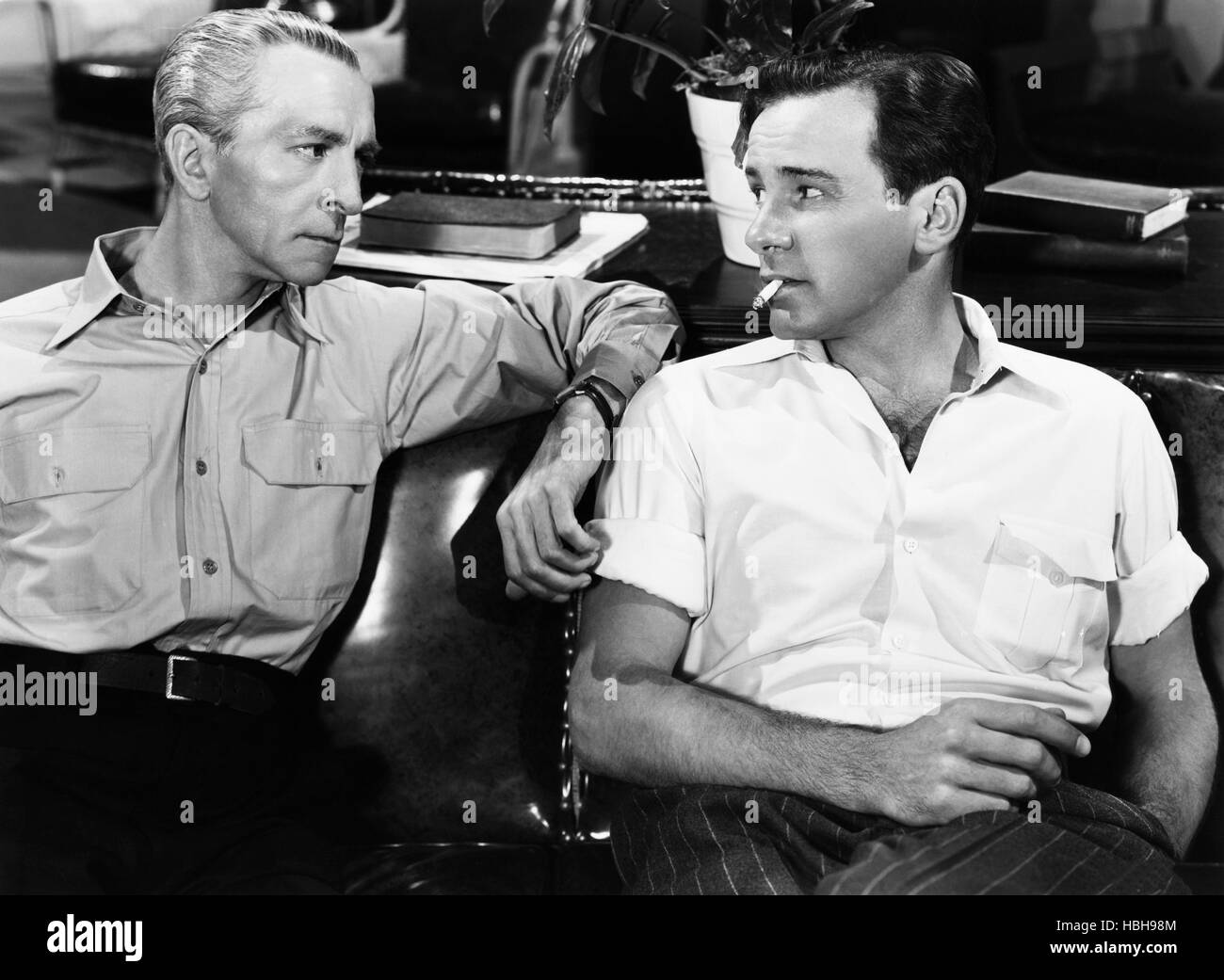 BEHIND LOCKED DOORS, from left Ralf Harolde, Richard Carlson, 1948