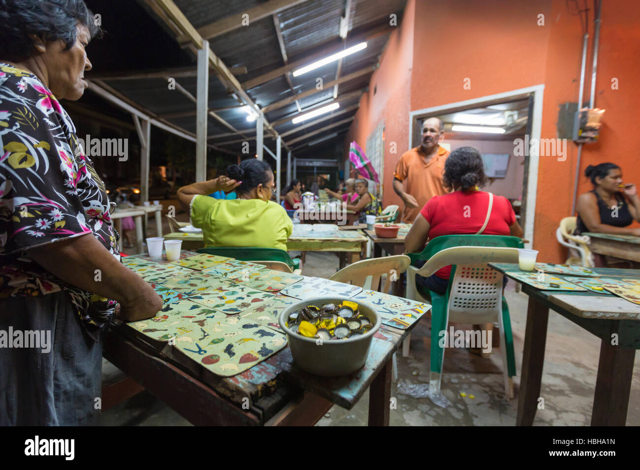 Colombian women playing bingo game outsite in the village center of Leticia, Brazil Stock Photo