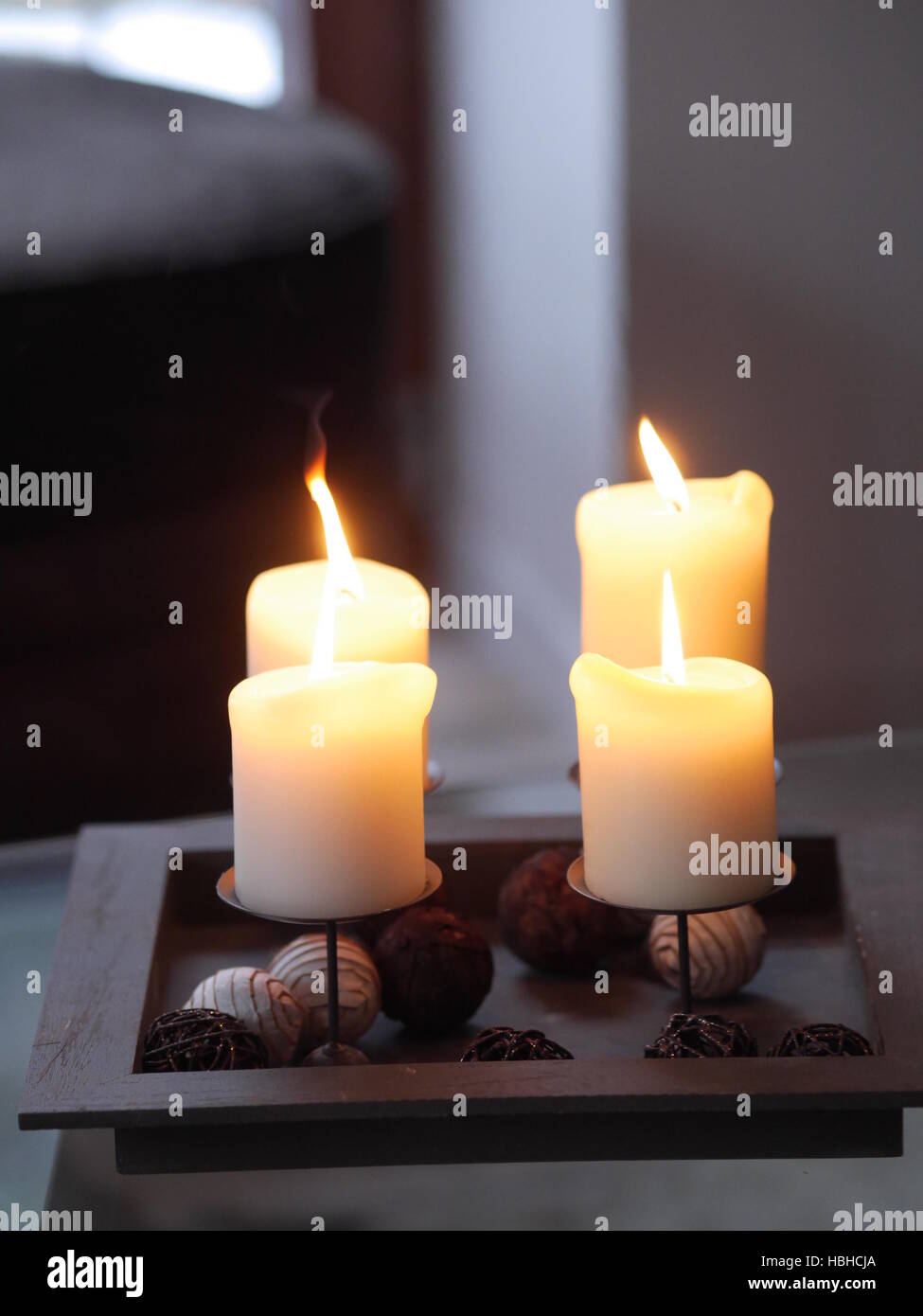 Four candles burning Stock Photo Alamy
