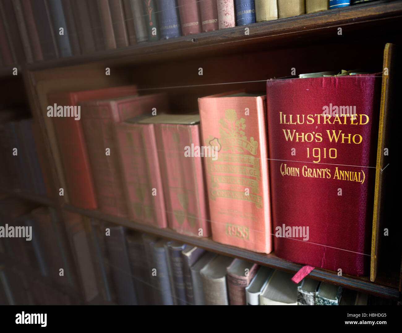 Illustrated Who's Who from 1910 in a bookcase Stock Photo