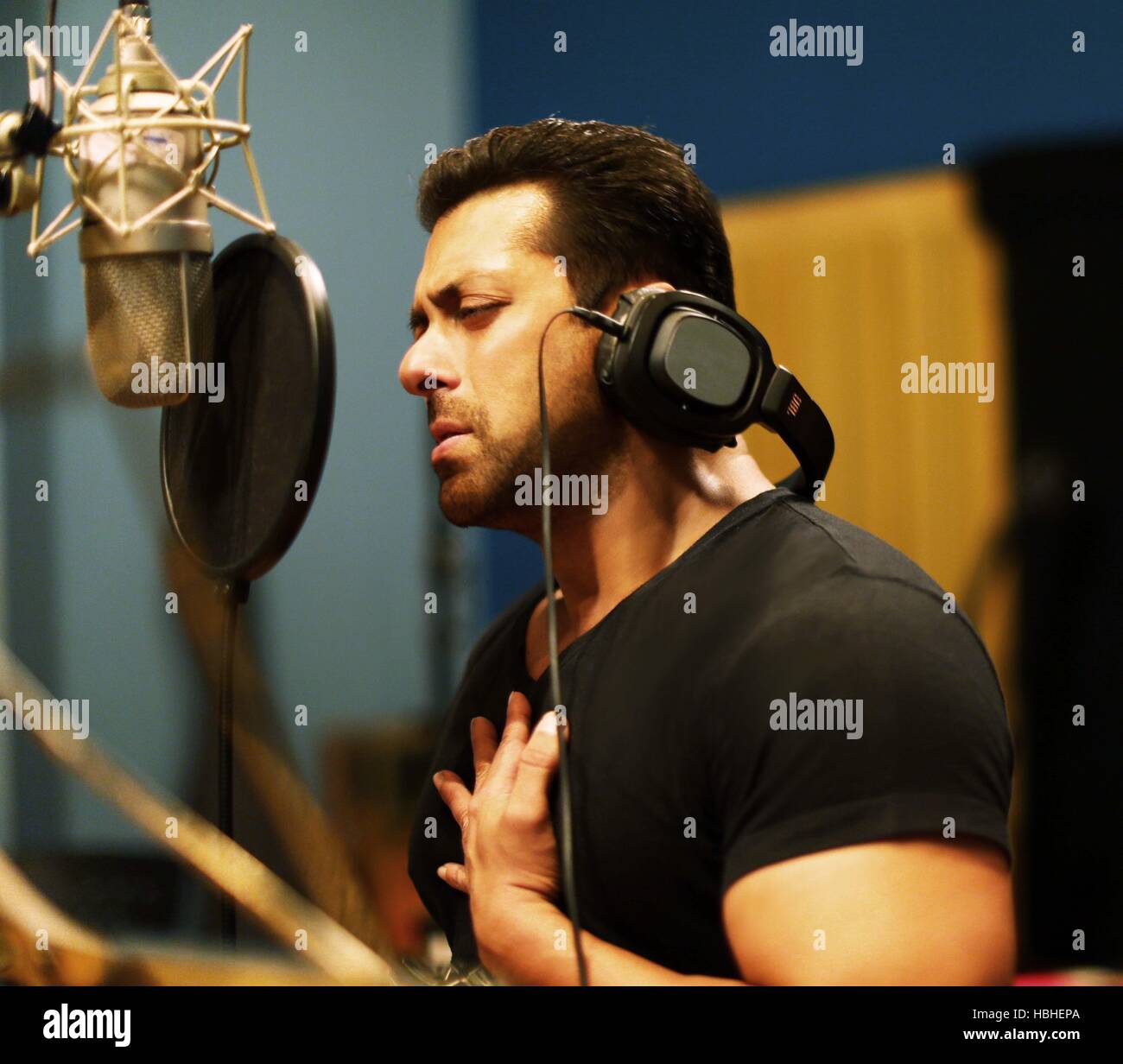 Bollywood actor Salman Khan sings the title track love song of his next home production 'Hero', in Mumbai, India Stock Photo