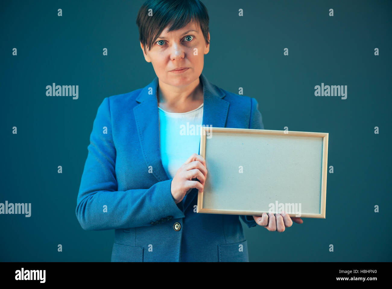 Business woman holding blank diploma certificate as copy space Stock Photo