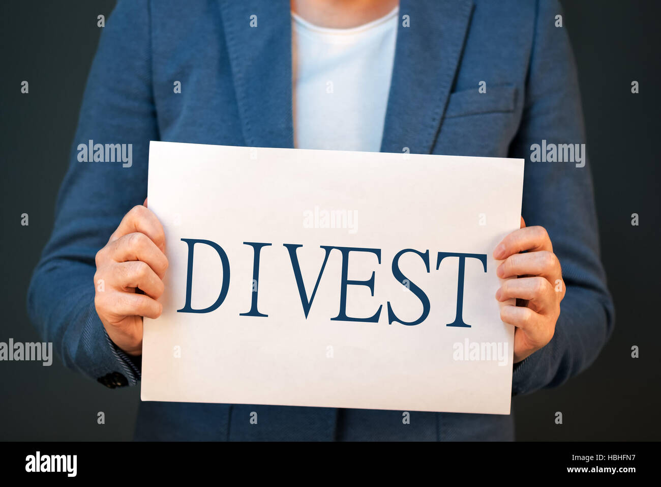 Divestment concept with businesswoman in suite - finance and economics business theme. Stock Photo