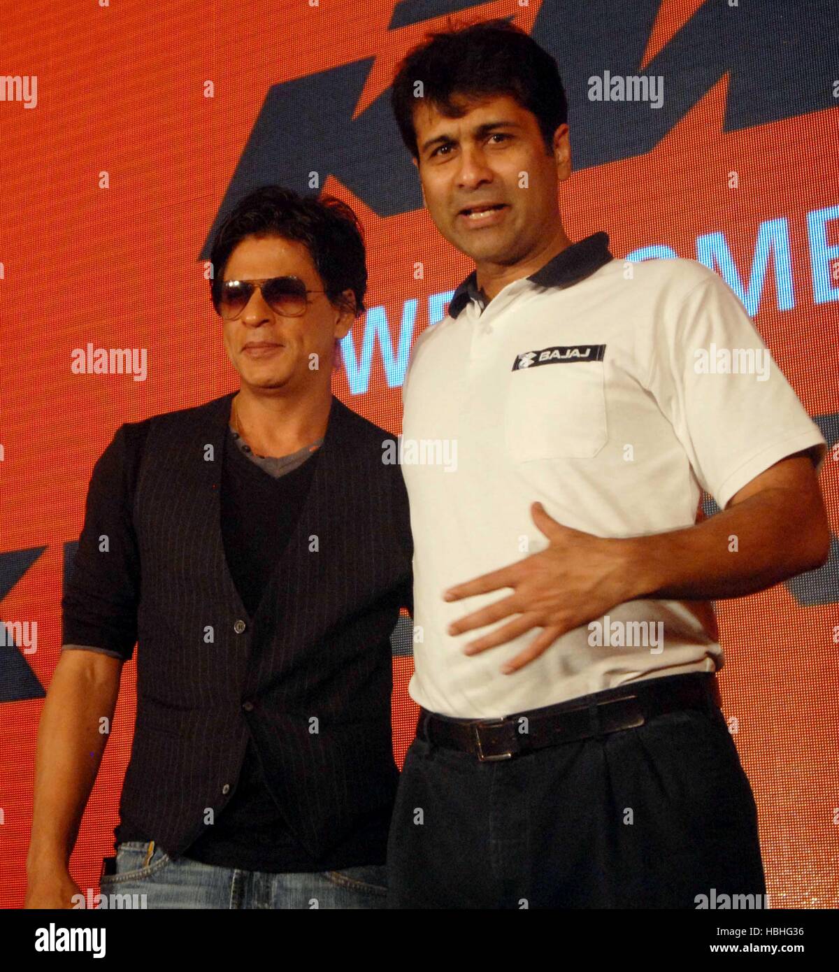 Shah Rukh Khan, Indian Bollywood actor with Rajiv Bajaj, MD, Bajaj Auto at conference of KTM Motorcycles in Pune India Stock Photo
