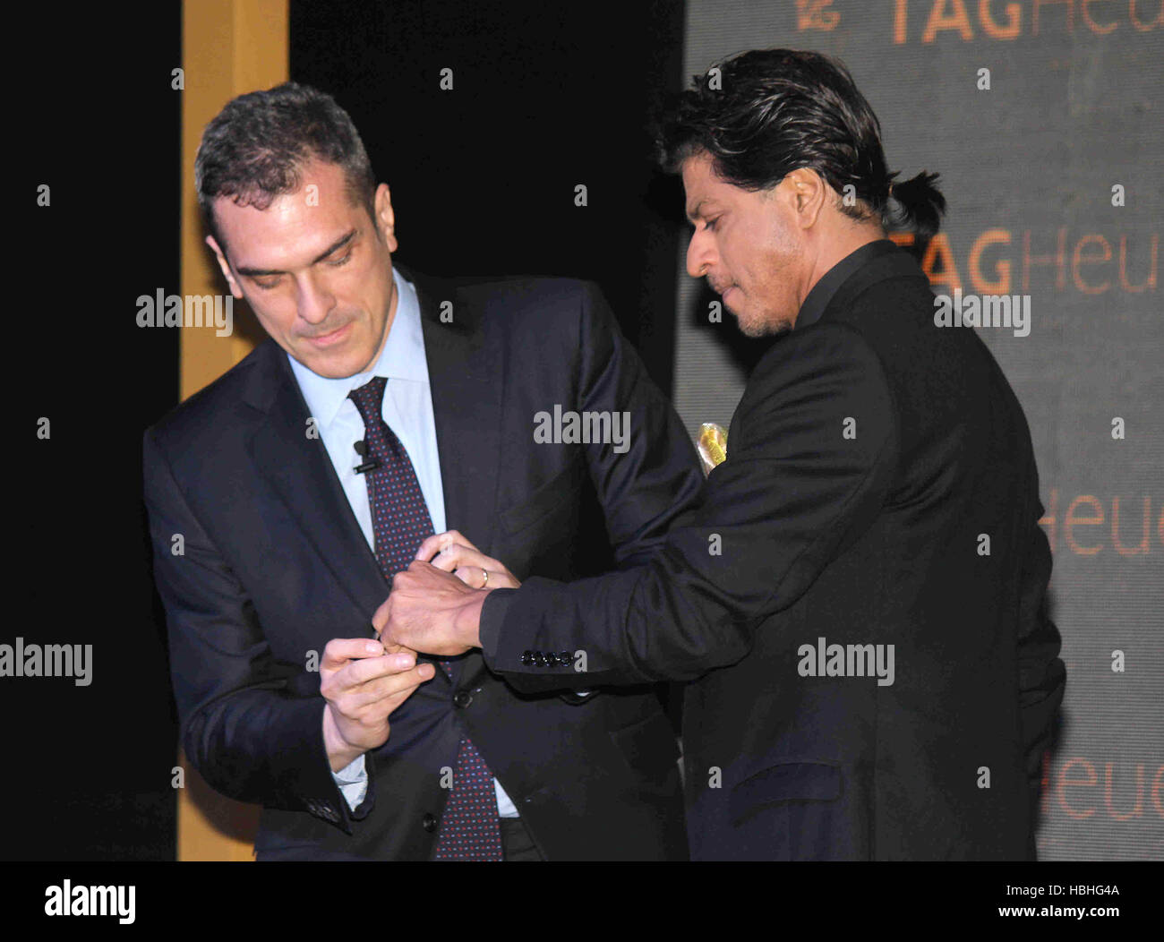 Bollywood actor Shah Rukh Khan receiving watch from Franck Dardenne General Manager Tag Heuer at event of Tag Heuer Golden Carrera collection Bombay Mumbai Maharashtra India Asia Stock Photo