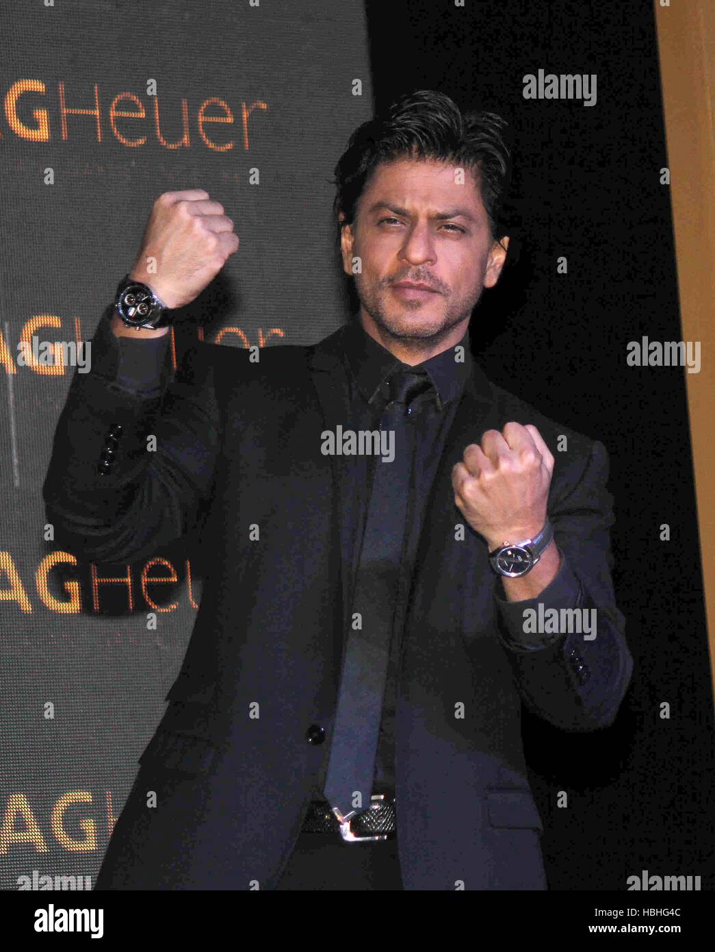 Bollywood actor Shah Rukh Khan showing Tag Heuer Golden Carrera watch collection Mumbai India Stock Photo