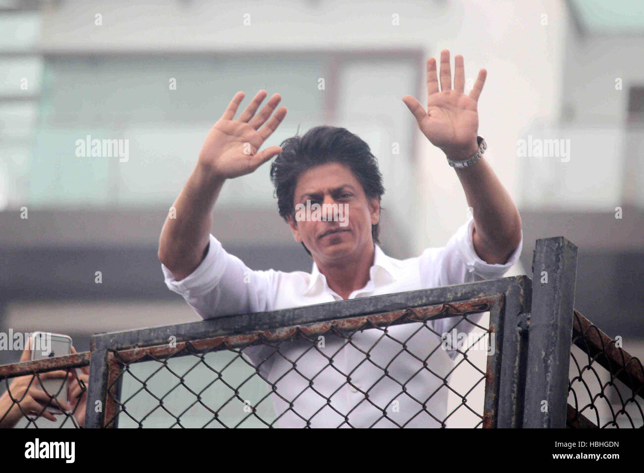 Shahrukh Khan waving his hands, Indian Bollywood actor on Eid al Fitr festival at his residence Mannat balcony in Mumbai, India Stock Photo