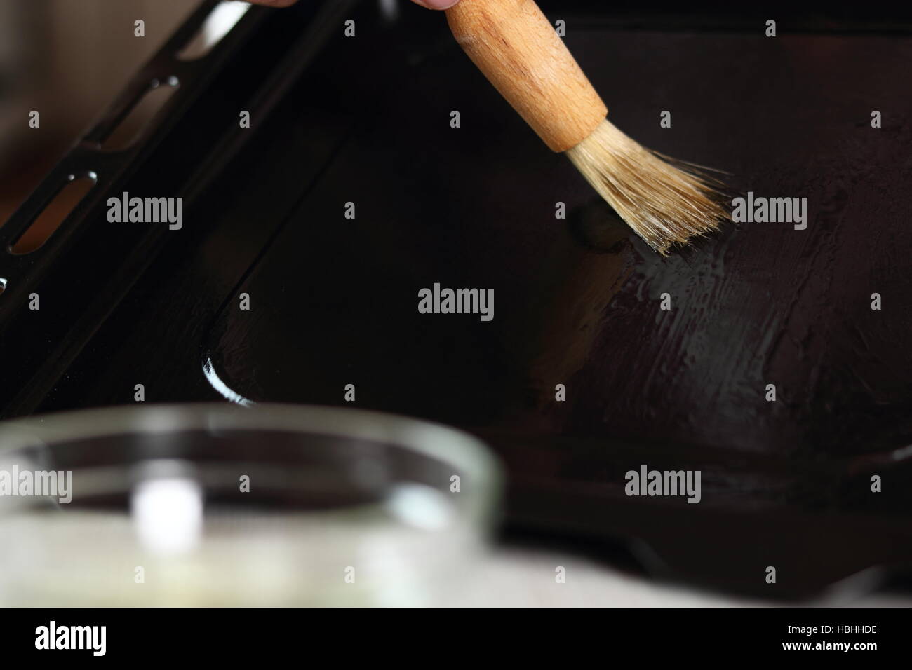 Brushing baking tray with oil. Making Chicken and Egg Galette Series
