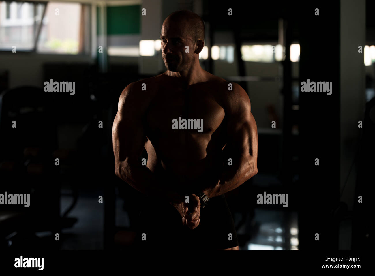 Bodybuilder Posing In Different Poses Demonstrating Their Muscles Male Showing Muscles