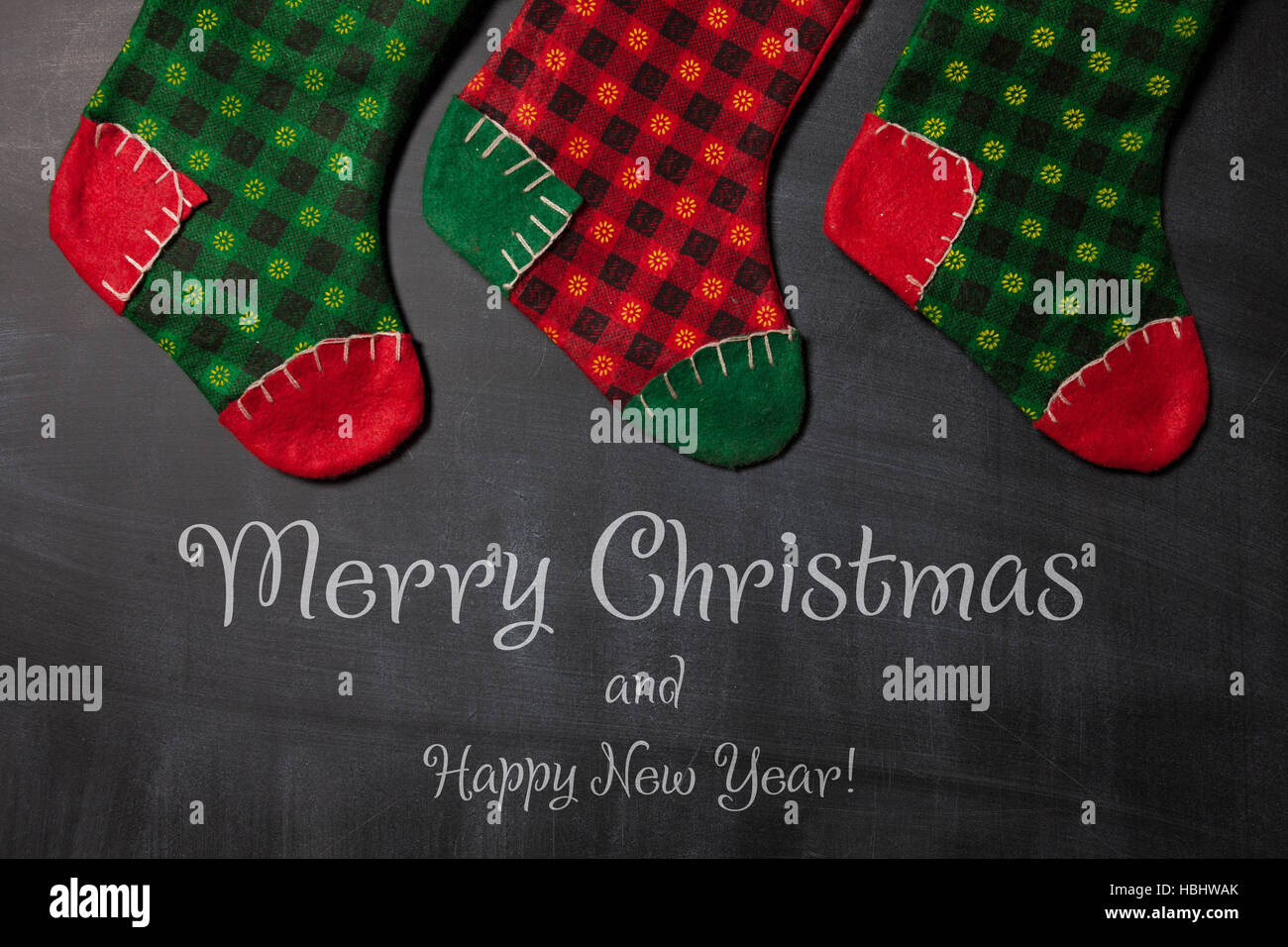 Christmas stocking on a blackboard background, xmas card Stock Photo