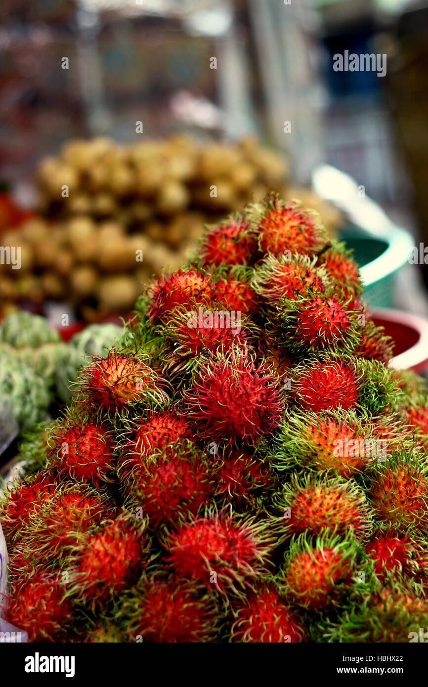 Rambutan and Lychee for sale at a market in Chinatown, Bangkok, Thailand. Stock Photo