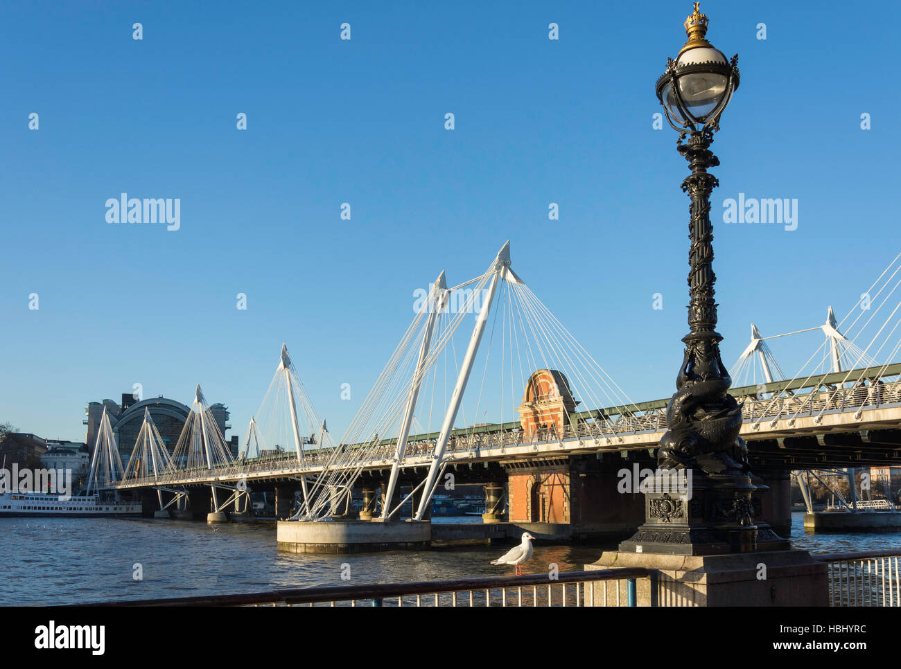 Hungerford Bridge and Golden Jubilee Pedestrian Bridge across River Thames, London Borough of Lambeth, Greater London, England, United Kingdom Stock Photo