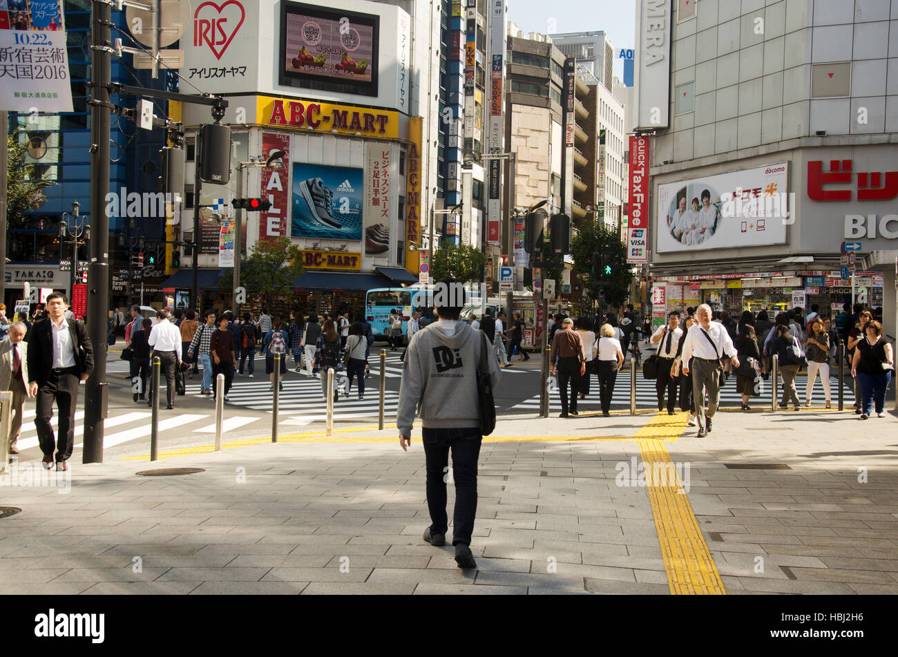 Japanese people walking crosswalk traffic road at shinjuku city on