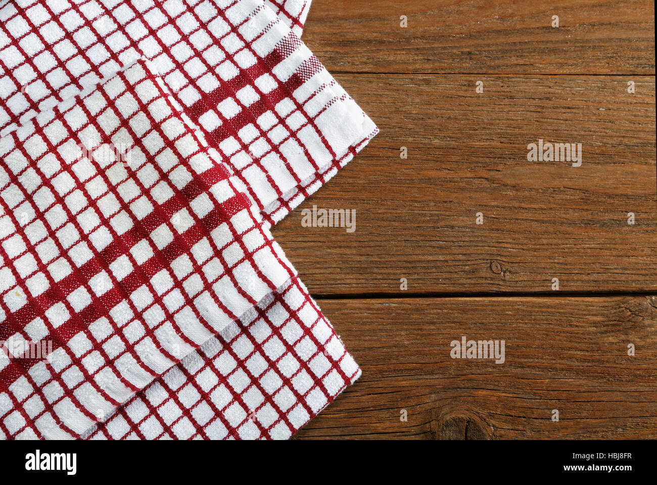 https://c8.alamy.com/comp/HBJ8FR/kitchen-towels-on-rustic-table-HBJ8FR.jpg