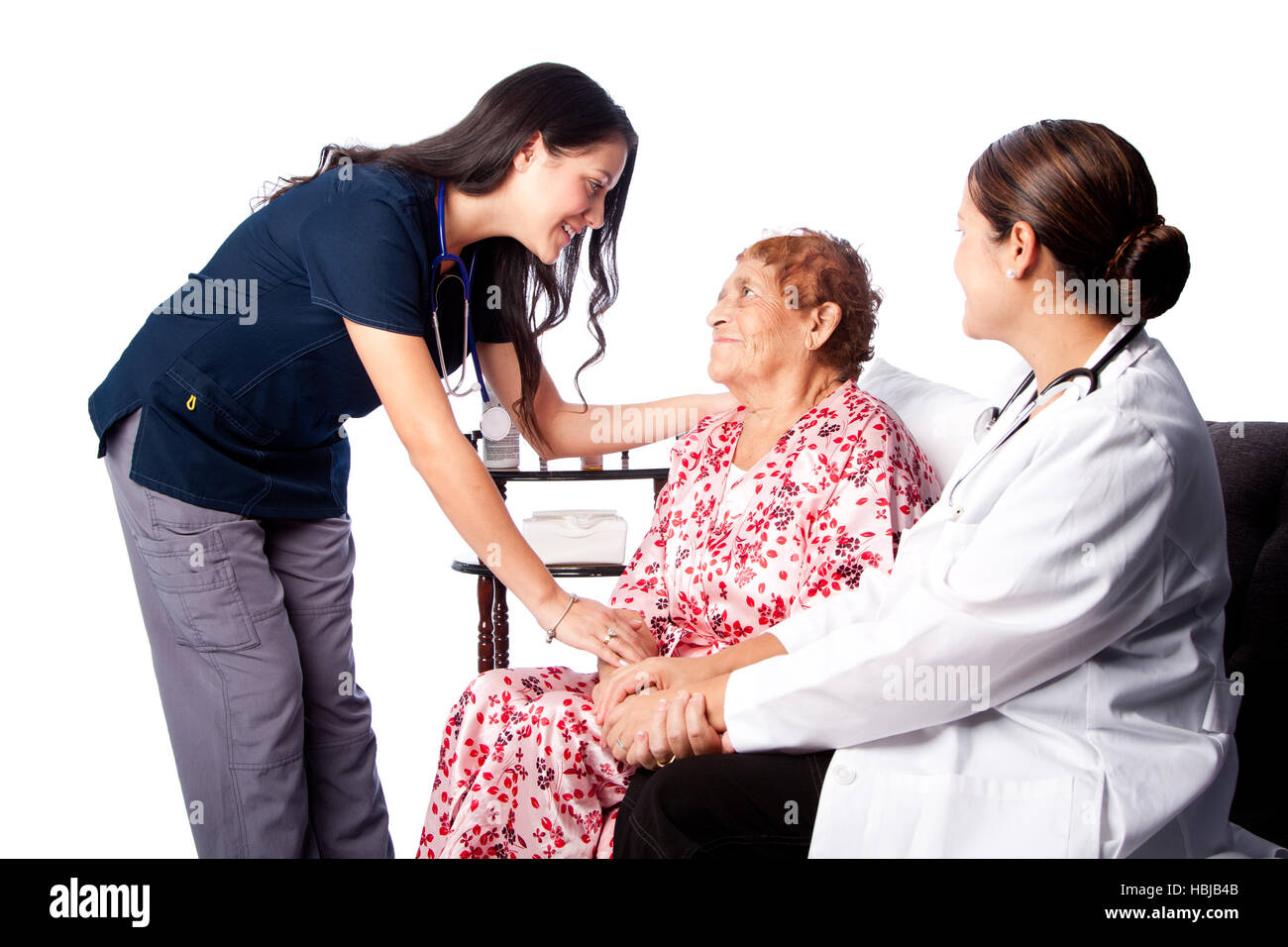 Doctor and Nurse consulting Senior Patient Stock Photo