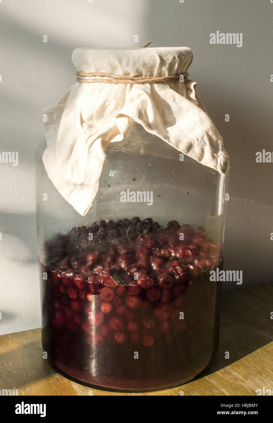 Jar with sugar soaked sour cherries Stock Photo Alamy