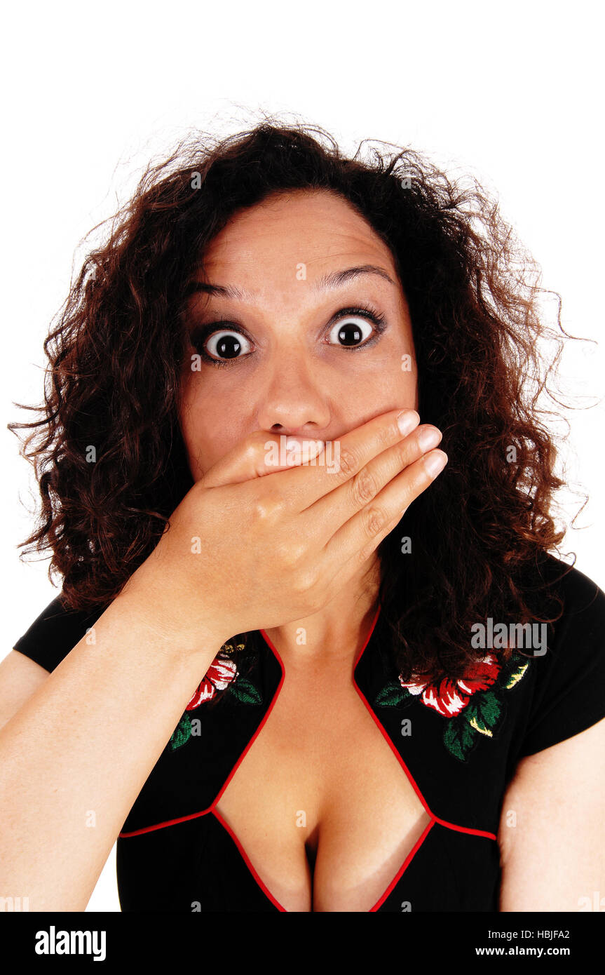 Shocked woman with hand over mouth. Stock Photo