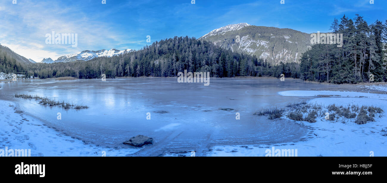 Alpine frozen lake Stock Photo - Alamy