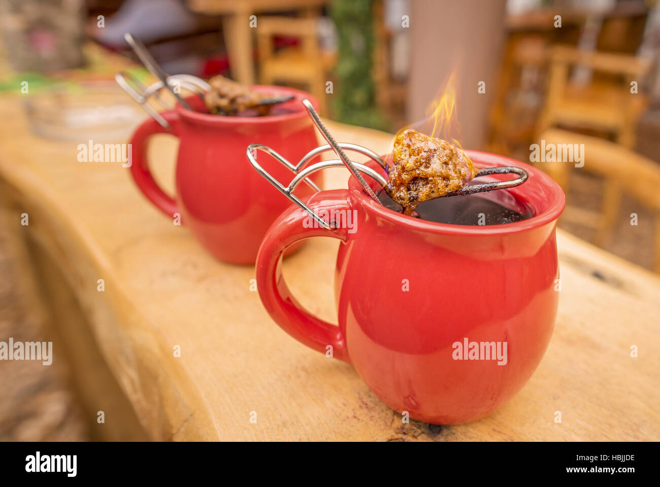 German drink, hot wine and flaming sugar Stock Photo - Alamy