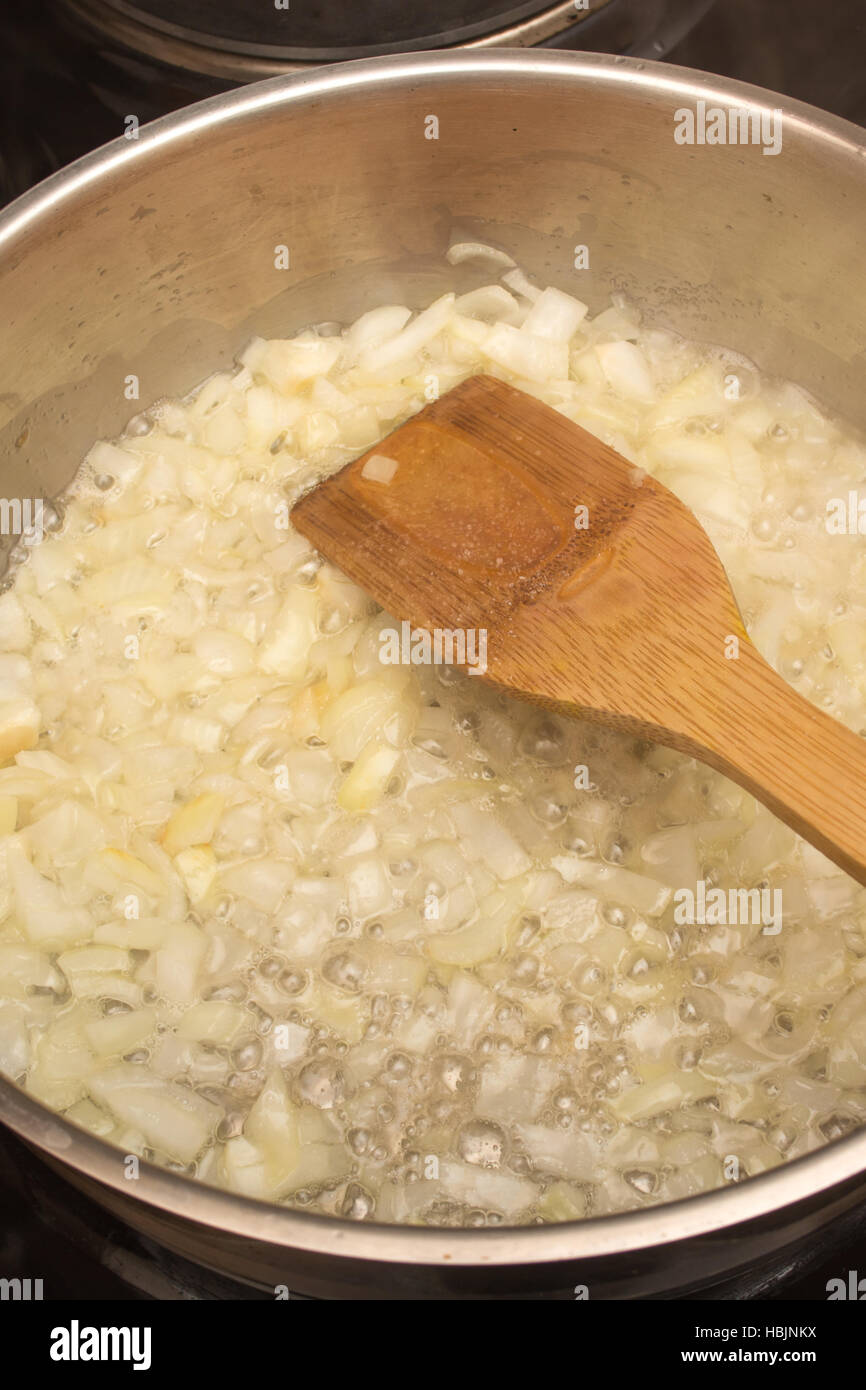 Frying onion in a pan Stock Photo Alamy