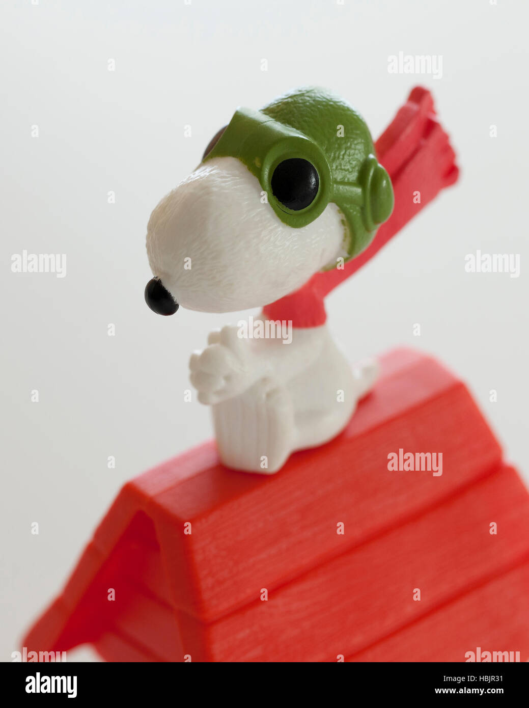 Snoopy sitting on top of doghouse model toy - USA Stock Photo