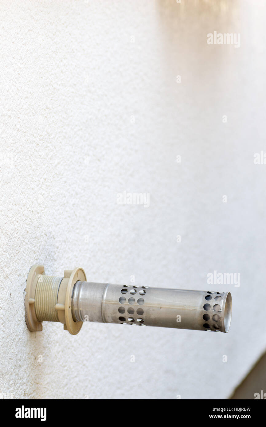 Japanese common metal exhaust pipe of air heating system on the white wall Stock Photo