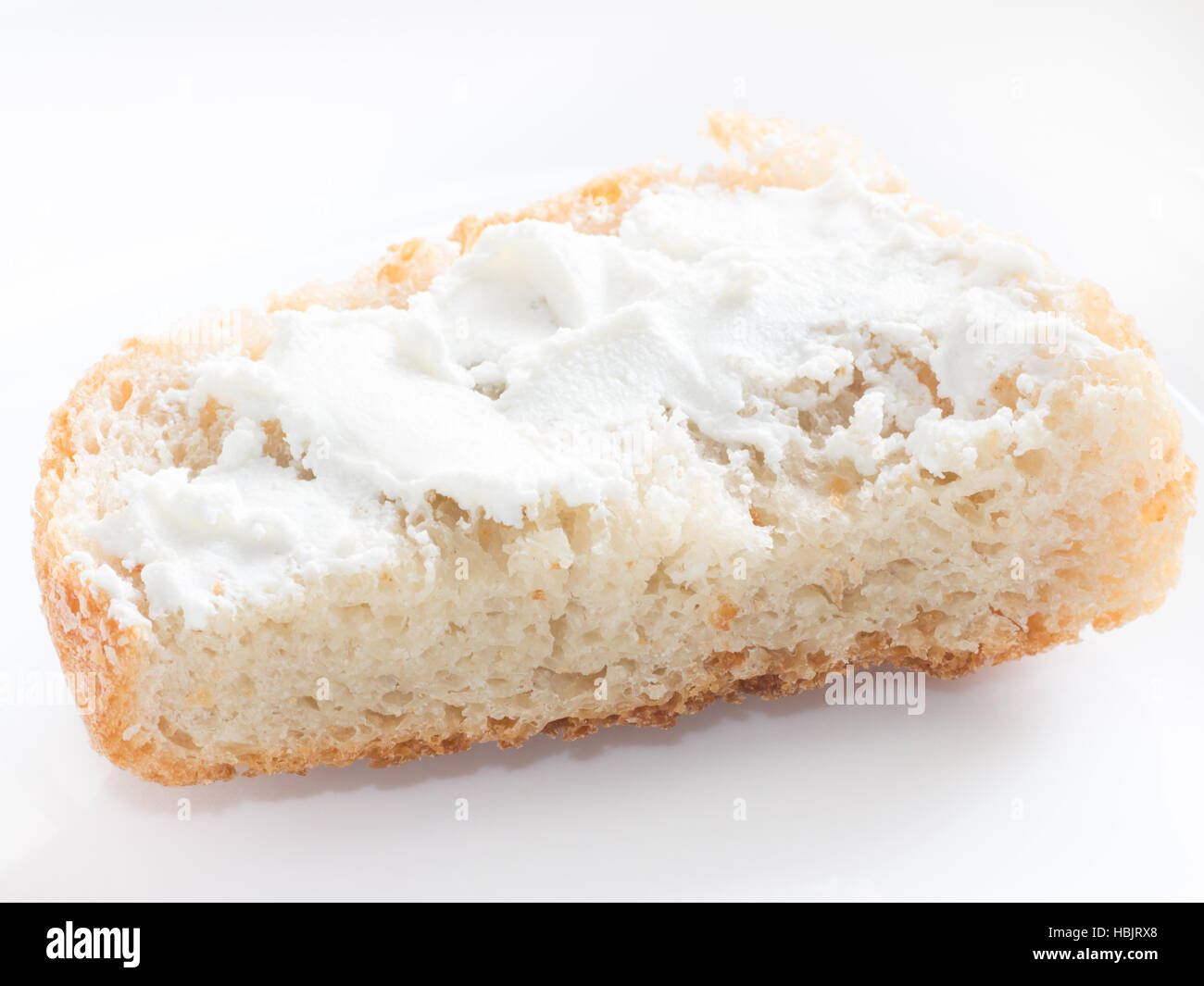 Simple Piece Of Bread With Cottage Cheese Spread On White Isolated